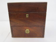19th century mahogany cased apothecary chest with hinged lid enclosing various fitted glass bottles,