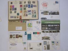 Post boy stamp album with loose GB first day covers, some with railway theme