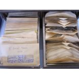 Many hundreds of envelopes with loose stamps from a variety of countries, mainly GB, in two drawer
