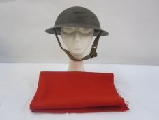 WWII Home Guard helmet with red material manufactured in Stroud factory for the Royal Guards uniform