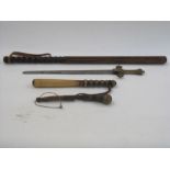 Two wooden truncheons, a shillelagh and a brass-handled ceremonial sword with Gothic decoration