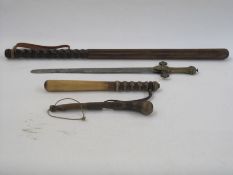Two wooden truncheons, a shillelagh and a brass-handled ceremonial sword with Gothic decoration