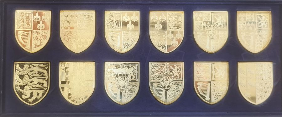 The Silver Collection of the Royal Arms 12 hallmarked shields, 581g, on box of issue and 12