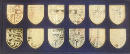 The Silver Collection of the Royal Arms 12 hallmarked shields, 581g, on box of issue and 12