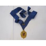9ct gold medal with Gloucester City Coat of Arms, inscription on back 'PERCY DANIEL CLARKE, M.B.E