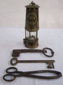 Large '21' key, another large key, a miner's lamp 'The Protector Lamp and Lighting Company