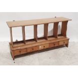 Vintage pine wall-hanging rack with pigeonhole type shelves above five short drawers, 109cm x 56cm