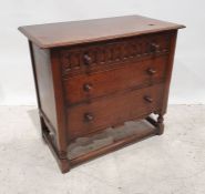 20th century oak chest of three long drawers, the rectangular top with moulded edge above the