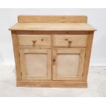 Early 20th century pine dresser, the rectangular top with rounded front corners, above two drawers