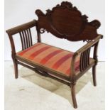 Early 20th century mahogany two-seat bench with carved and shaped backsplat, red upholstered seat,