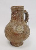 Rhenish stoneware bellarmine jug applied three continental crests in oval tablets, 20cm high
