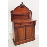 Early 20th century walnut sideboard, the carved back with single narrow shelf, on turned front