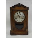 Early 20th century mahogany bracket clock with Roman numerals to the steel dial, on plinth base