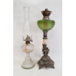 Metal and green glass oil lamp (no shade) and a moulded glass oil lamp with funnel (no shade) (2)