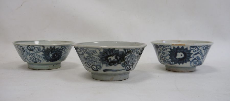 Set of three Chinese porcelain bowls with underglaze blue scrolling flowerhead design, 14cm diameter