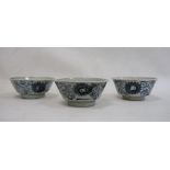 Set of three Chinese porcelain bowls with underglaze blue scrolling flowerhead design, 14cm diameter