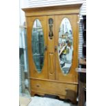 20th century oak Arts & Crafts-style two-door wardrobe with moulded cornice above two mirrored