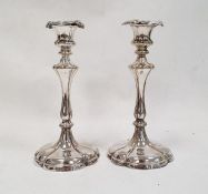 Pair of 20th century silver plated mounted candlesticks, rounded hexagonal design, marked 'E&Co'