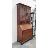 19th century mahogany bureau bookcase, the moulded cornice above astragal glazed doors enclosing