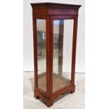 20th century yew display cabinet with single glazed door enclosing glass shelves, the whole on