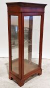 20th century yew display cabinet with single glazed door enclosing glass shelves, the whole on