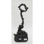 Victorian cast iron doorstop of scrolled form, 40cm tall