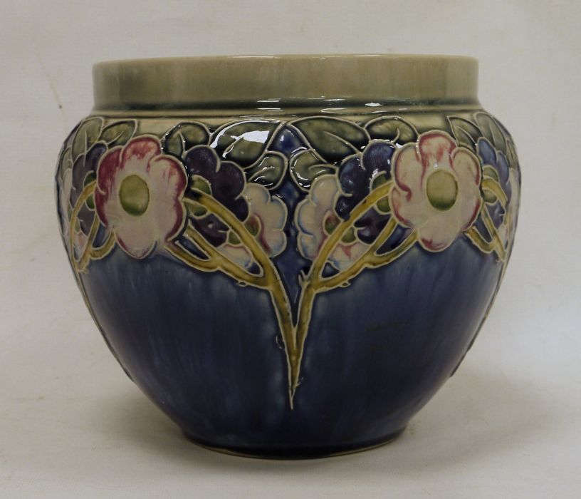 Royal Doulton stoneware jardiniere, floral and leaf tube-lined design, on a blue ground, marked to