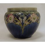 Royal Doulton stoneware jardiniere, floral and leaf tube-lined design, on a blue ground, marked to