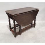 20th century reproduction gateleg table in the 18th century style, the oval top with drop leaves, on