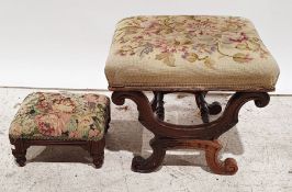 Victorian stool with needlework upholstered top, curvy X-shaped end supports united by turned