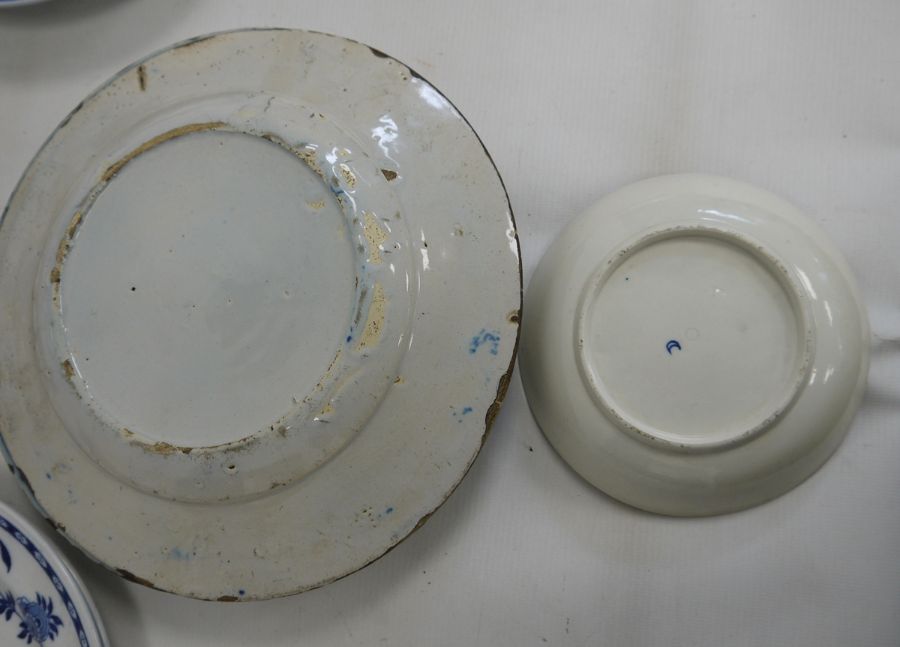 Two old Delft plates, blue and white decorated with floral and fence-pattern to the centre, stylised - Image 4 of 4