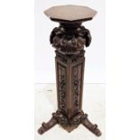 19th century mahogany stand, the octagonal top on heavily carved base, 118cm high