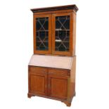 George III satinwood bureau bookcase having ovolo cornice, dentil frieze, pair astragal glazed doors