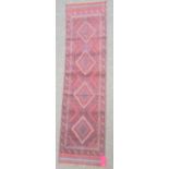 Meshwani runner, the central field with blue and red lozenges within multiple borders, 236cm x