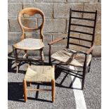 Low ladderback armchair with rush seat, cane seated chair and a stool (3)