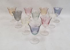 Various tinted, coloured and clear liqueurs, two green and clear moulded cream jug, various matching