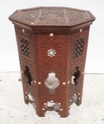 Eastern style coffee table, with octagonal top, and carved decoration