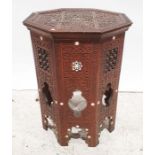 Eastern style coffee table, with octagonal top, and carved decoration