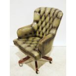 20th century office swivel chair in green buttonback leather upholstery