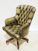 20th century office swivel chair in green buttonback leather upholstery