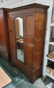 Early 20th century mahogany single mirrored door wardrobe, moulded cornice above the mirrored