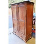 Early 20th century mahogany two-door wardrobe with blind fretwork carved decoration to the doors,