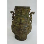 Cast bronze baluster vase-patterned table lamp, two-handled and on carved hardwood scroll base,