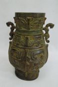 Cast bronze baluster vase-patterned table lamp, two-handled and on carved hardwood scroll base,