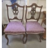 Pair of mahogany-framed bedroom chairs with purple upholstered overstuffed seats, cabriole front