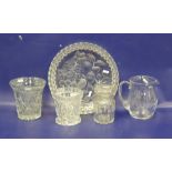 Cut glass water jug, two slice cut vases, a canister and a large cut strawberry-pattern shallow dish