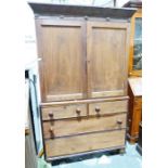 19th century mahogany linen press, the moulded cornice above two cupboard doors enclosing linen