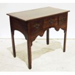 Georgian-style oak lowboy, the rectangular top with moulded edge above three drawers, shaped
