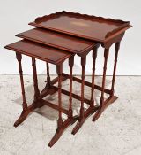 20th century mahogany and inlaid nest of three tables, the largest table with three-quarter