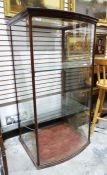 Shop display cabinet, the mahogany frame with bow glass front, glass sides and glass shelves, 68cm x